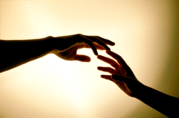 hands-touching-reaching-out